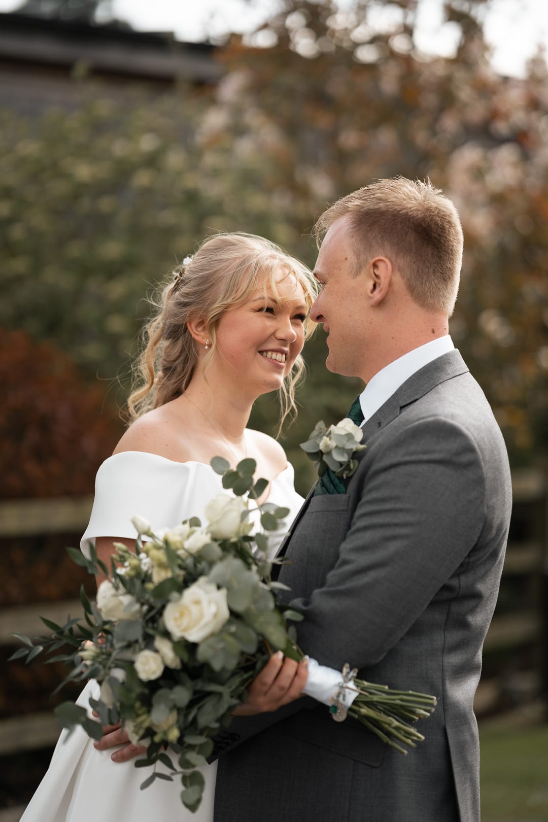 couple looking at each other, wedding at Mythe Barn